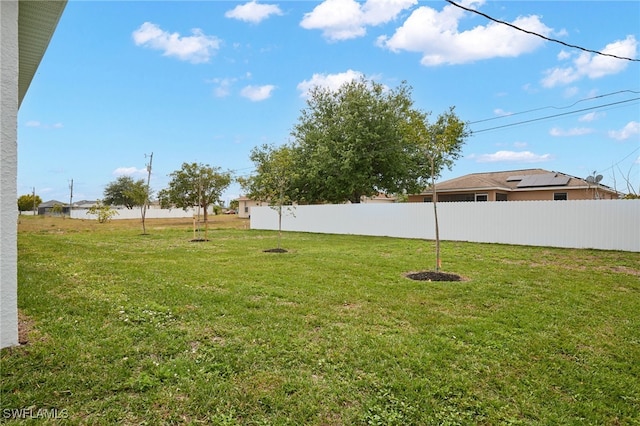 view of yard with fence