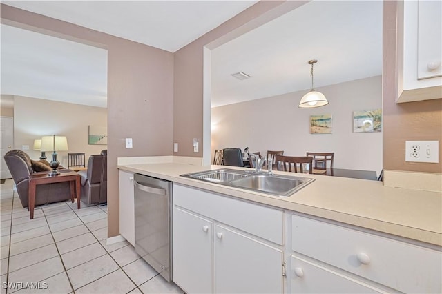 kitchen with light countertops, a sink, white cabinetry, dishwasher, and visible vents