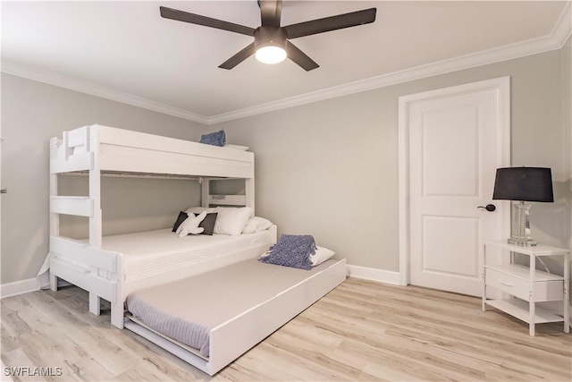 7973 Estero Blvd, Fort Myers Beach, FL 33931 - bedroom featuring crown molding, baseboards, a ceiling fan, and light wood-type flooring