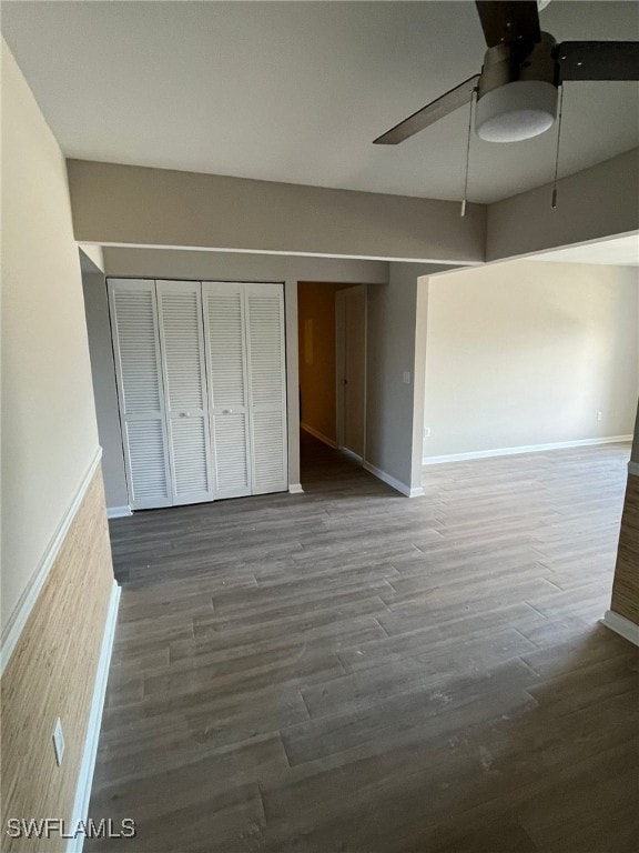 6824 Sandtrap Dr Unit 4, Fort Myers, FL 33919 - unfurnished bedroom with a ceiling fan, baseboards, and wood finished floors