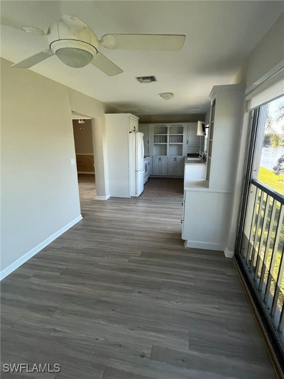 6824 Sandtrap Dr Unit 4, Fort Myers, FL 33919 - corridor featuring baseboards, visible vents, dark wood-style floors, and a sink
