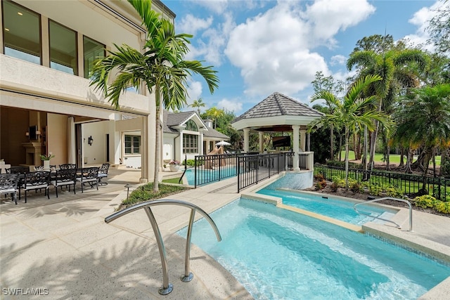 4300 Brynwood Dr, Naples, FL 34119 - view of pool with a gazebo, a pool with connected hot tub, a patio area, and fence