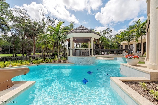 4300 Brynwood Dr, Naples, FL 34119 - view of swimming pool featuring fence, a gazebo, a water slide, and a fenced in pool