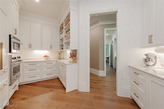 4300 Brynwood Dr, Naples, FL 34119 - kitchen with light wood-style flooring, light countertops, open shelves, white cabinets, and double oven