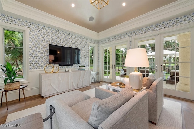 4300 Brynwood Dr, Naples, FL 34119 - living area with plenty of natural light, french doors, wood finished floors, and crown molding