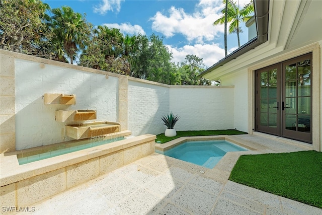 4300 Brynwood Dr, Naples, FL 34119 - view of swimming pool with french doors and a fenced backyard