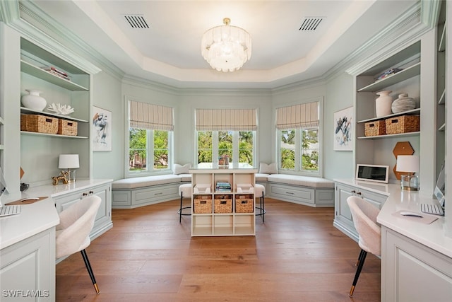 4300 Brynwood Dr, Naples, FL 34119 - interior space with light wood-type flooring, visible vents, a tray ceiling, and an inviting chandelier