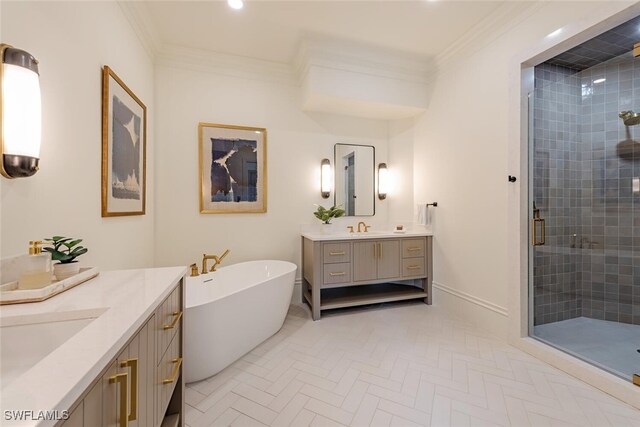 4300 Brynwood Dr, Naples, FL 34119 - bathroom with two vanities, ornamental molding, a sink, a freestanding bath, and a stall shower