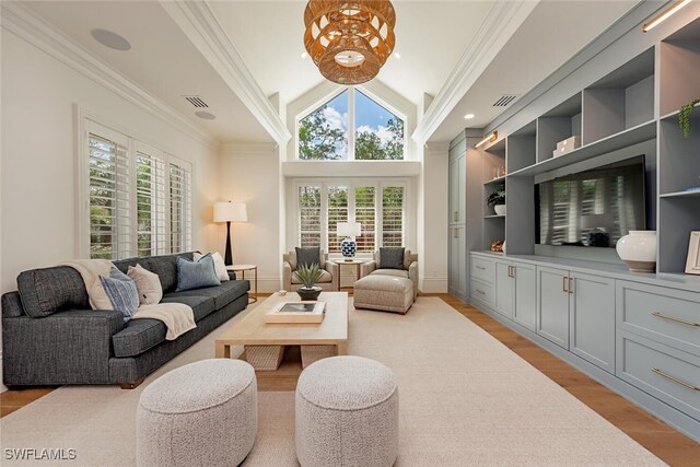 4300 Brynwood Dr, Naples, FL 34119 - living room with lofted ceiling, visible vents, and plenty of natural light