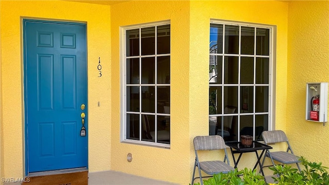 14512 Abaco Lakes Dr Unit 103, Fort Myers, FL 33908 - doorway to property featuring stucco siding