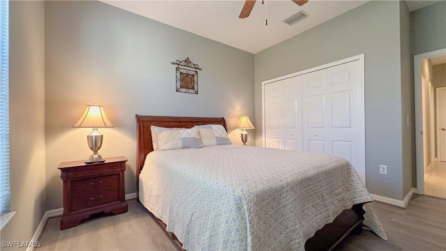 14512 Abaco Lakes Dr Unit 103, Fort Myers, FL 33908 - bedroom featuring a closet, visible vents, baseboards, wood finished floors, and a ceiling fan