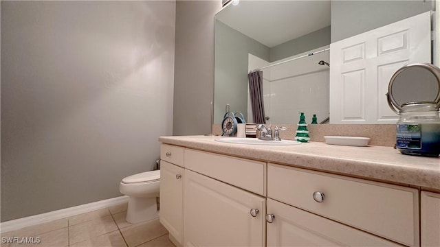 14512 Abaco Lakes Dr Unit 103, Fort Myers, FL 33908 - full bathroom with a shower with shower curtain, toilet, vanity, tile patterned flooring, and baseboards