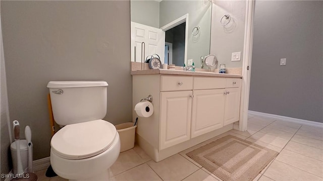 14512 Abaco Lakes Dr Unit 103, Fort Myers, FL 33908 - bathroom featuring baseboards, toilet, tile patterned floors, and vanity