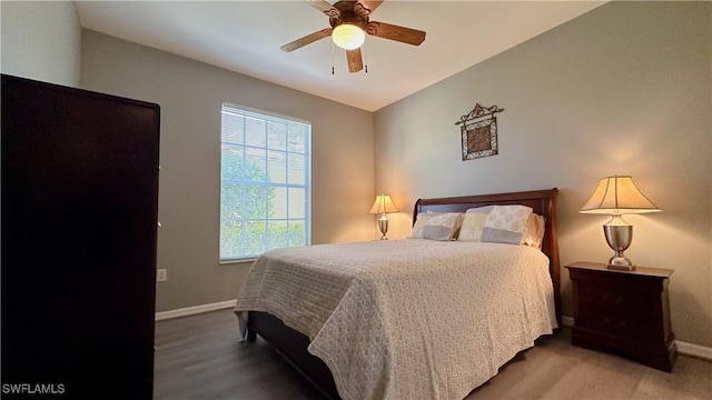14512 Abaco Lakes Dr Unit 103, Fort Myers, FL 33908 - bedroom featuring baseboards, vaulted ceiling, wood finished floors, and ceiling fan