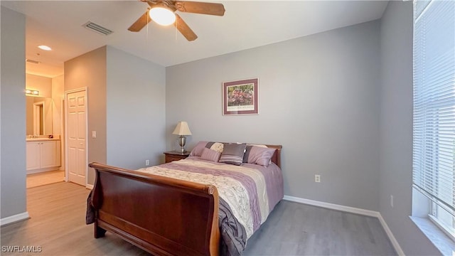 14512 Abaco Lakes Dr Unit 103, Fort Myers, FL 33908 - bedroom with baseboards, visible vents, wood finished floors, and ceiling fan