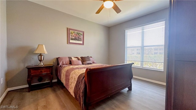 14512 Abaco Lakes Dr Unit 103, Fort Myers, FL 33908 - bedroom with baseboards, ceiling fan, and wood finished floors