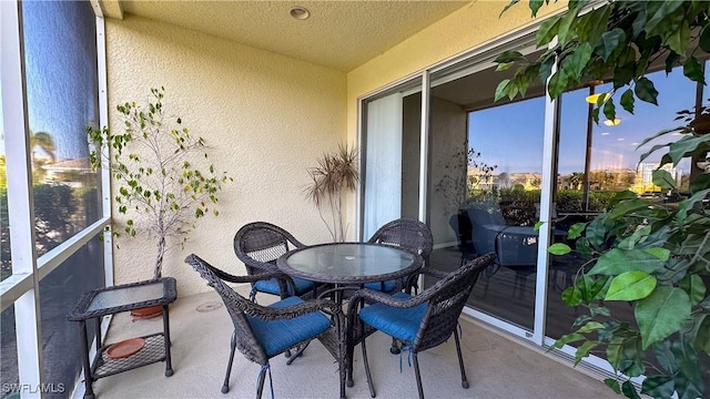 14512 Abaco Lakes Dr Unit 103, Fort Myers, FL 33908 - sunroom featuring outdoor dining area