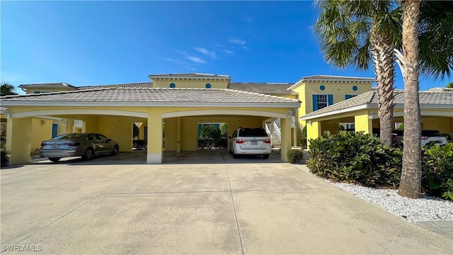14512 Abaco Lakes Dr Unit 103, Fort Myers, FL 33908 - view of front of property featuring driveway and stucco siding