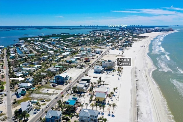 birds eye view of property featuring a view of the beach and a water view