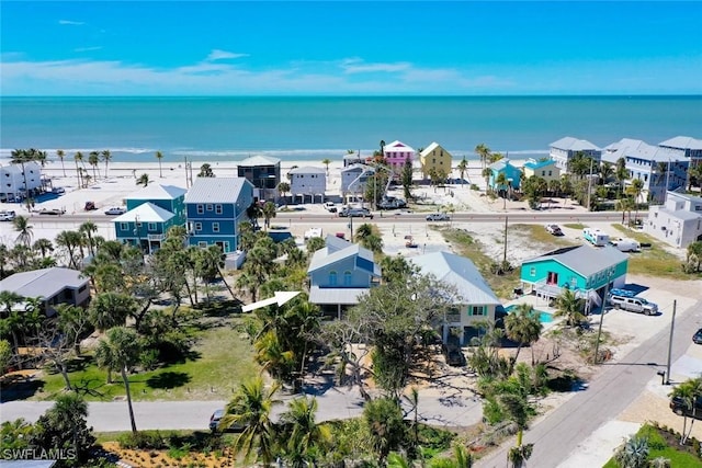 birds eye view of property with a residential view and a water view