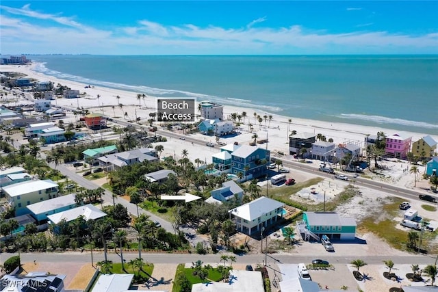 bird's eye view featuring a view of the beach and a water view