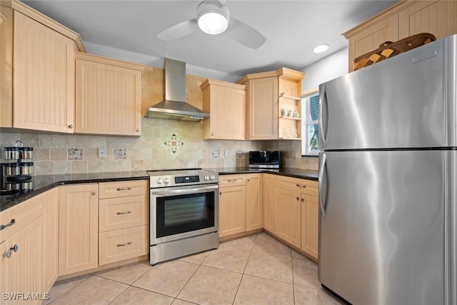 kitchen with light tile patterned floors, wall chimney exhaust hood, light brown cabinetry, and appliances with stainless steel finishes