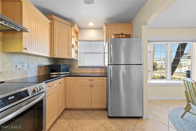 kitchen featuring light tile patterned floors, plenty of natural light, stainless steel appliances, light brown cabinetry, and under cabinet range hood