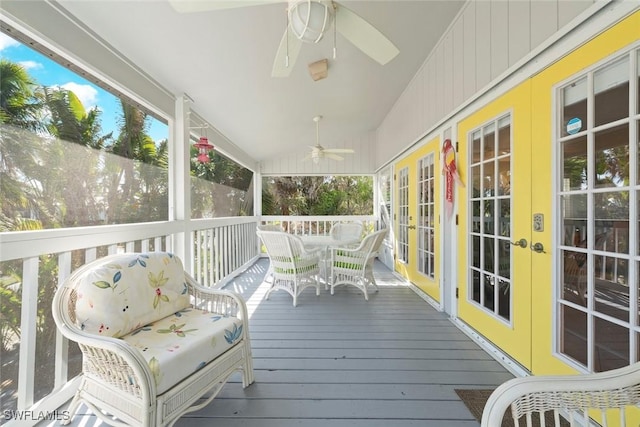 sunroom featuring a wealth of natural light, ceiling fan, and french doors