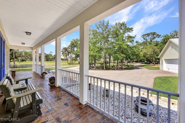 17150 Scout Camp Rd, Alva, FL 33920 - view of patio featuring a porch and a garage