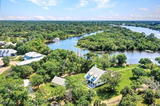 17150 Scout Camp Rd, Alva, FL 33920 - aerial view featuring a wooded view and a water view