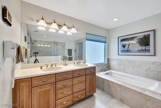 17150 Scout Camp Rd, Alva, FL 33920 - bathroom featuring double vanity, a sink, tiled shower, and a garden tub