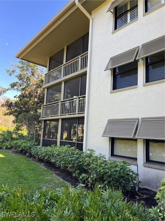 3661 Wild Pines Dr Unit 205, Bonita Springs, FL 34134 - view of side of property with stucco siding
