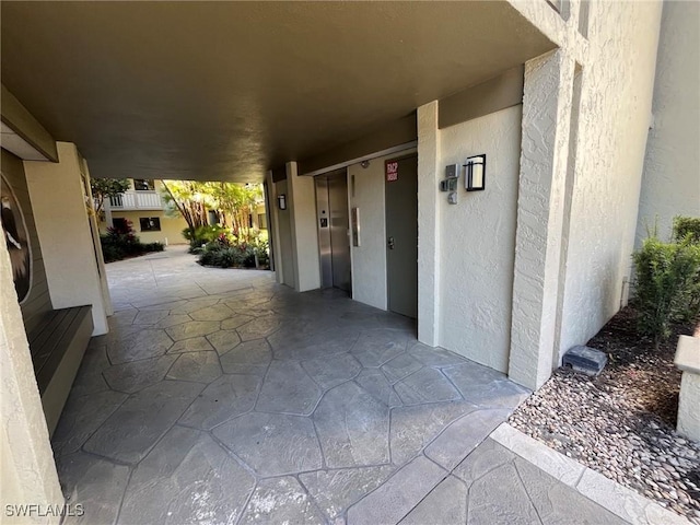 3661 Wild Pines Dr Unit 205, Bonita Springs, FL 34134 - exterior space featuring elevator and stucco siding