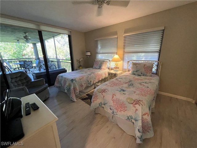 3661 Wild Pines Dr Unit 205, Bonita Springs, FL 34134 - bedroom with ceiling fan, wood finished floors, baseboards, and access to exterior