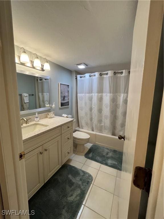 3661 Wild Pines Dr Unit 205, Bonita Springs, FL 34134 - full bathroom with tile patterned floors, toilet, vanity, and shower / bathtub combination with curtain