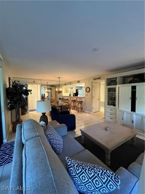 3661 Wild Pines Dr Unit 205, Bonita Springs, FL 34134 - living area featuring an inviting chandelier and light tile patterned floors