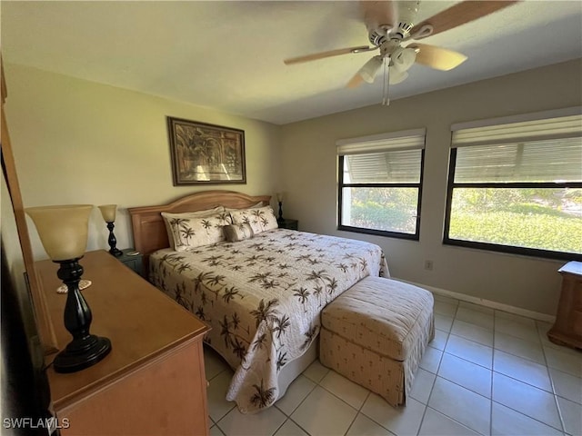 3661 Wild Pines Dr Unit 205, Bonita Springs, FL 34134 - bedroom with baseboards, ceiling fan, and light tile patterned flooring