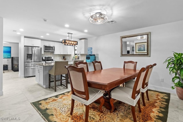7090 Hendry Creek Dr, Fort Myers, FL 33908 - dining room featuring marble finish floor, recessed lighting, baseboards, and visible vents