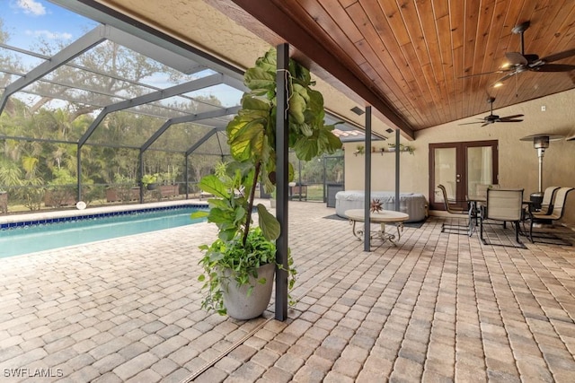 7090 Hendry Creek Dr, Fort Myers, FL 33908 - view of patio / terrace with a lanai, an outdoor pool, french doors, and a ceiling fan