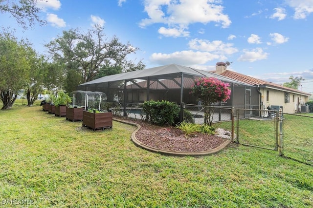 7090 Hendry Creek Dr, Fort Myers, FL 33908 - view of yard featuring a gate, fence, central AC, and a lanai