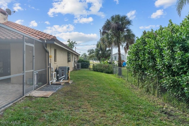 7090 Hendry Creek Dr, Fort Myers, FL 33908 - view of yard with central AC and a fenced backyard