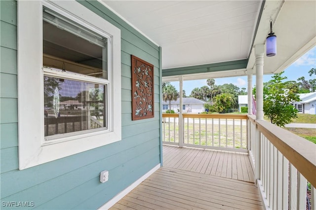 6070 Lacota Ave, Fort Myers, FL 33905 - wooden deck with covered porch