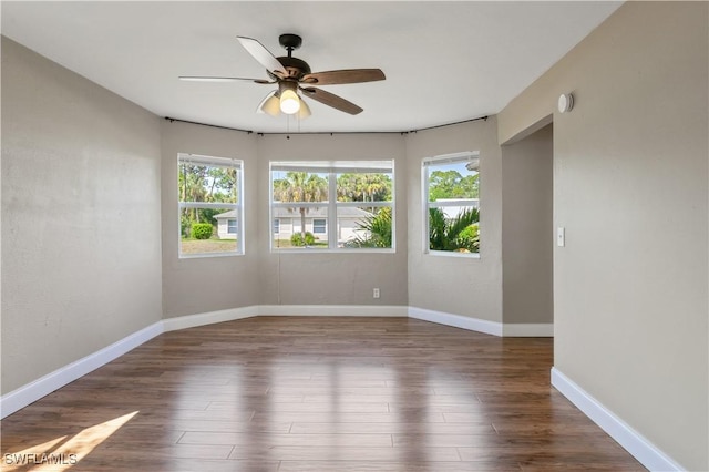 6070 Lacota Ave, Fort Myers, FL 33905 - unfurnished room with a ceiling fan, wood finished floors, and a wealth of natural light