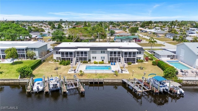 bird's eye view featuring a residential view and a water view