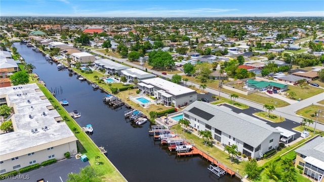 birds eye view of property featuring a residential view and a water view