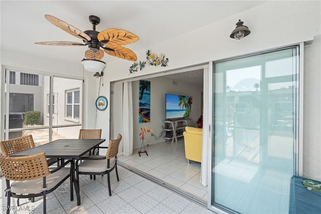 dining room featuring a wealth of natural light, a ceiling fan, and light tile patterned floors
