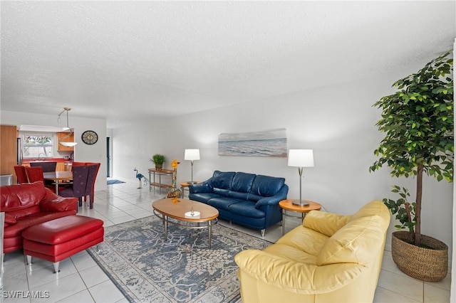 living area featuring tile patterned floors and a textured ceiling