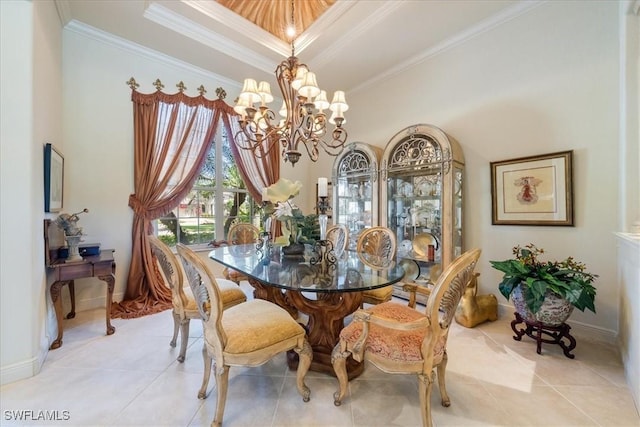 dining area with ornamental molding, baseboards, an inviting chandelier, and light tile patterned flooring