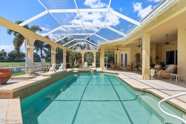 view of swimming pool with a patio area, french doors, glass enclosure, and a ceiling fan