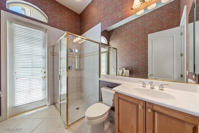 bathroom featuring a stall shower, wallpapered walls, tile patterned floors, and a healthy amount of sunlight